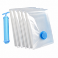 Five clear vacuum storage bags with a blue manual hand pump and blue valve on a white background